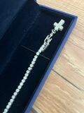 Tennis bracelet with charm