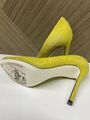 Yellow suede pumps