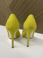 Yellow suede pumps