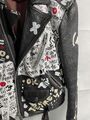 Graffiti-print leather biker jacket