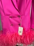 Pink tuxedo dress with feathers