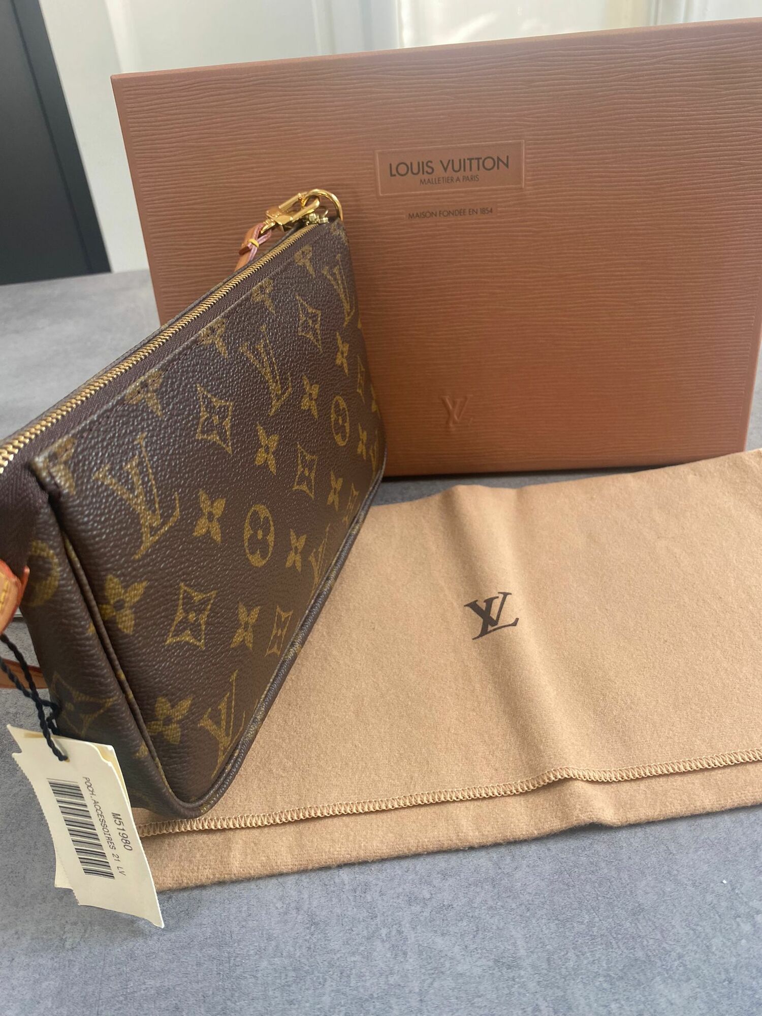 lv maison fondee en 1854 bag