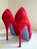 Red suede pumps
