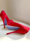 Red suede pumps