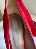 Red suede pumps