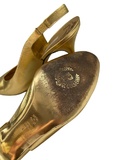Gold leather slingback shoes