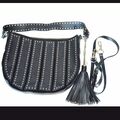 Leather bag with metallic accessories