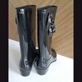 Knee high rain boots