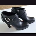 Ankle boots with metal accessory