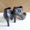 Ankle boots with metal accessory