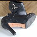 Ankle boots with metal accessory